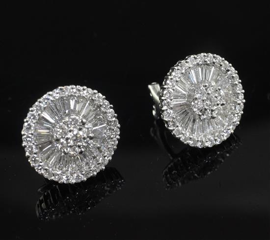 A modern pair of 18ct white gold and diamond target earrings, diameter 15mm.